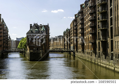 The Warehouse District (Speicherstadt) in Hamburg, Germany, on sunny day. View of Wandrahmsfleet. The largest warehouse district in the world is located in the port of Hamburg within the HafenCity 108590501