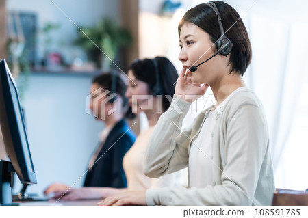 Young woman working in a call center Young woman working in a call center 108591785
