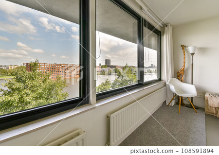a room with a view of the water and buildings from it's window simn, taken from inside a room with a view of the water and buildings from it's window simn, taken from inside 108591894