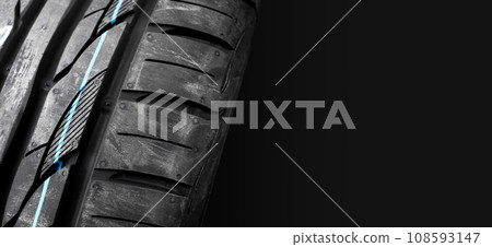 New car tires with colored lines on the tread , car tyre horizontal banner with copy space New car tires with colored lines on the tread , car tyre horizontal banner with copy space 108593147