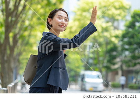 A woman raising her hand A woman raising her hand 108593211