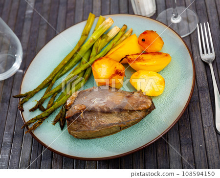 Delicious veal with potatoes and asparagus 108594150