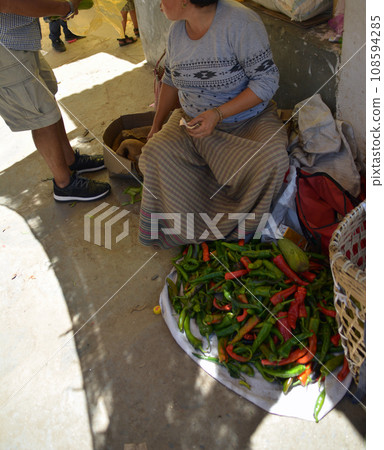Large chili peppers (Khuruthang, Punakha) sold at Bhutan market, the land of happiness Large chili peppers (Khuruthang, Punakha) sold at Bhutan market, the land of happiness 108594285