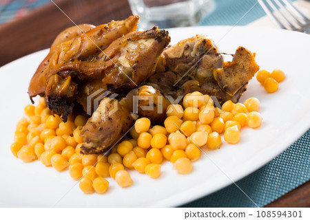 Spanish dish Pies de cerdo con garbanzos 108594301