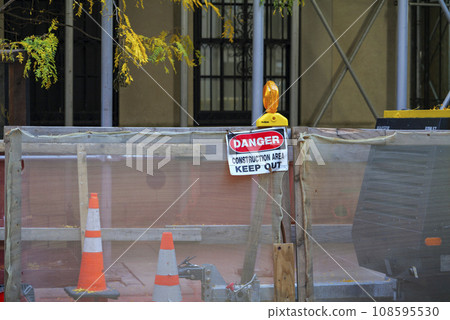 road closed sign and traffic cone in the street road closed sign and traffic cone in the street 108595530