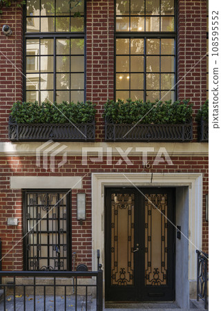 View of a Beautiful House Exterior and Front Door Seen on a Manhattan NYC 108595552