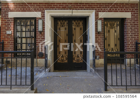 View of a Beautiful House Exterior and Front Door Seen on a Manhattan NYC 108595564