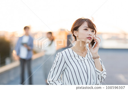 Young woman smartphone outdoors Young woman smartphone outdoors 108596307