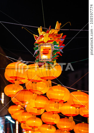 Yokohama cityscape in Japan 2024 Yokohama Chinatown with Chinese New Year lights. Dragon lanterns appear on Chinatown Boulevard = November 3rd 108597774