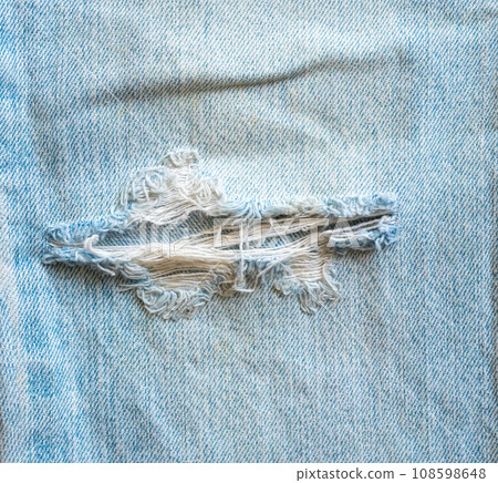 Denim blue jeans torn fashion design texture close up background top view 108598648