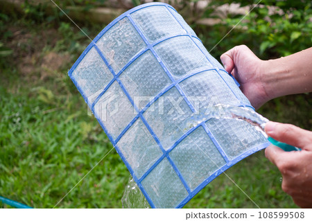 cleaning air conditioner dirty filter 108599508