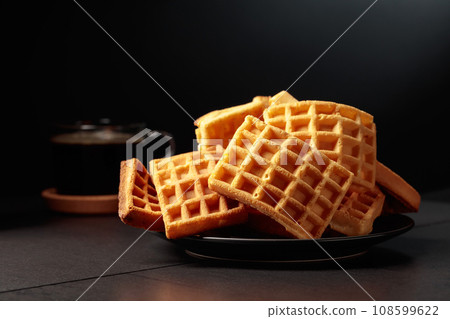 Belgian waffles and black coffee. 108599622