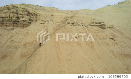 Colorful high mountains and a canyon made of clay Colorful high mountains and a canyon made of clay 108599703