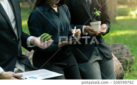 Businessman is analyzing about the environment and is concerned about global warming. Businessman is analyzing about the environment and is concerned about global warming. 108599782