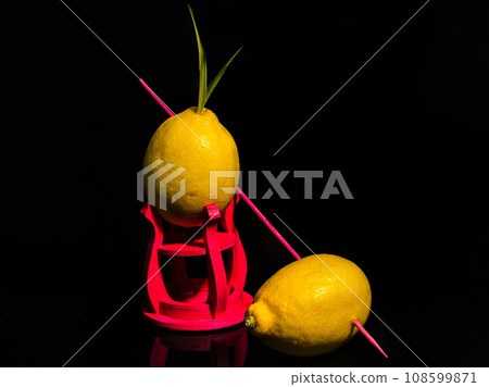 Composition with two lemons on a black background Composition with two lemons on a black background 108599871