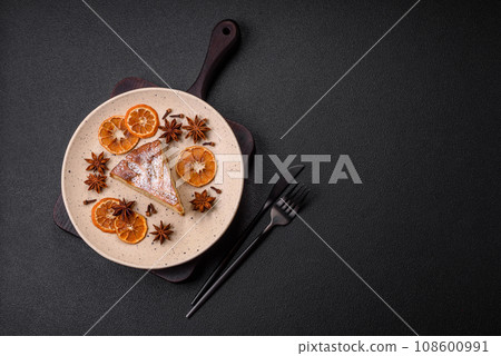 A piece of baked homemade pie with apple or pear, with cinnamon 108600991