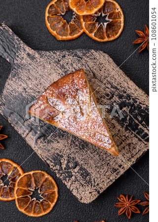 A piece of baked homemade pie with apple or pear, with cinnamon 108601054