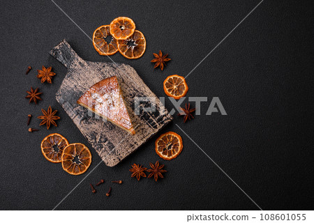 A piece of baked homemade pie with apple or pear, with cinnamon 108601055