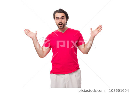 young surprised male promoter dressed in a red basic t-shirt. corporate clothing color young surprised male promoter dressed in a red basic t-shirt. corporate clothing color 108601694