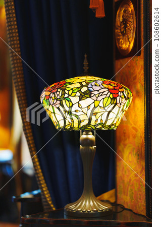 Tiffany's interior table lamp with a shade. Tiffany's interior table lamp with a shade. 108602614