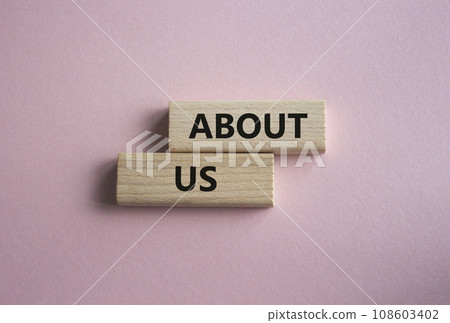 About us symbol. Concept word About us on wooden blocks. Beautiful pink background. Business and About us concept. Copy space 108603402