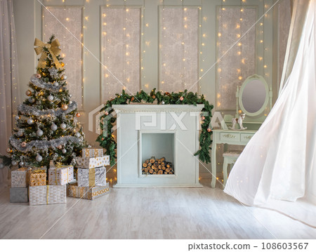 Beautiful holdiay decorated room with Christmas tree with presents under it. 108603567
