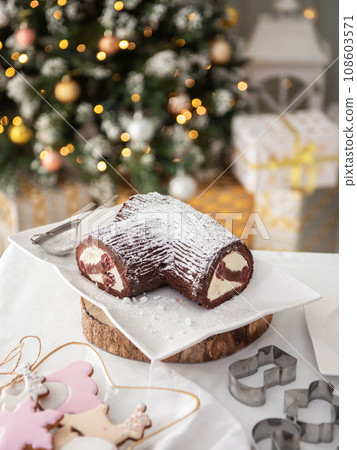 Festive cake for New Year's party, chocolate-vanilla icing with sparkling sprinkles Festive cake for New Year's party, chocolate-vanilla icing with sparkling sprinkles 108603571