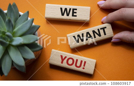 We want You symbol. Wooden blocks with words We want you. Beautiful orange background with succulent plant. Businessman hand. Business and We want You concept. Copy space We want You symbol. Wooden blocks with words We want you. Beautiful orange background with succulent plant. Businessman hand. Business and We want You concept. Copy space 108603917