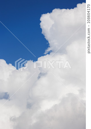 white cumulus clouds in blue sky, beautiful view of the sky and storm clouds. Huge majestic cloud  108604170