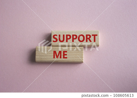 Support me symbol. Wooden blocks with words Support me. Beautiful pink background. Business and Support me concept. Copy space. 108605613