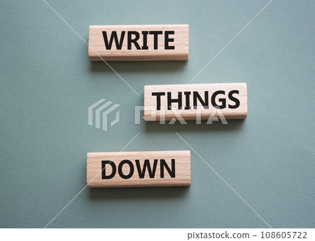 Write things down symbol. Concept words Write things down on wooden blocks. Beautiful grey green background. Business and Write things down concept. Copy space. 108605722