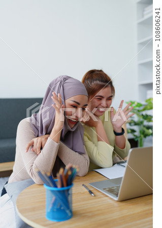 Muslim undergraduates and Asian women are studying online using computers Muslim undergraduates and Asian women are studying online using computers 108606241
