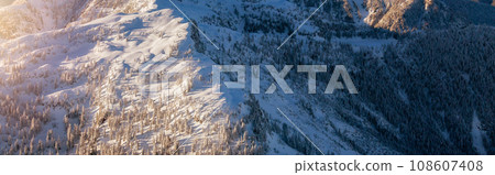 Snow covered Mountain Peak. Canadian Nature Aerial Background Panorama. Snow covered Mountain Peak. Canadian Nature Aerial Background Panorama. 108607408