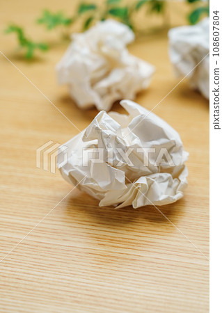 rolled up scrap paper 108607804