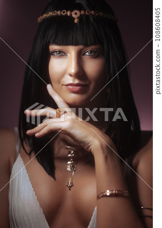 Queen Cleopatra Fashion Beauty Portrait With Touching Face by Hand 108608405