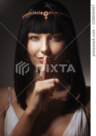 Queen Cleopatra Fashion Beauty Female Portrait With Hinger on Her Lips 108608407