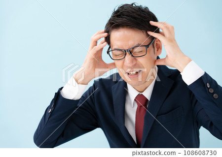 Businessman middle-aged holding his head Businessman middle-aged holding his head 108608730