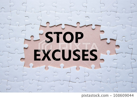 Stop excuses symbol. Concept words Stop excuses on white puzzle. Beautiful pink background. Business and Stop excuses concept. Copy space. 108609044