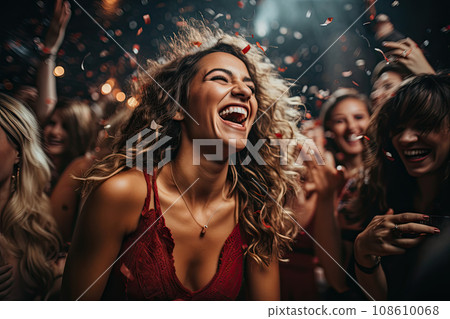 a woman at a party with her hair blowing in the wind, surrounded by coning confectionals 108610068