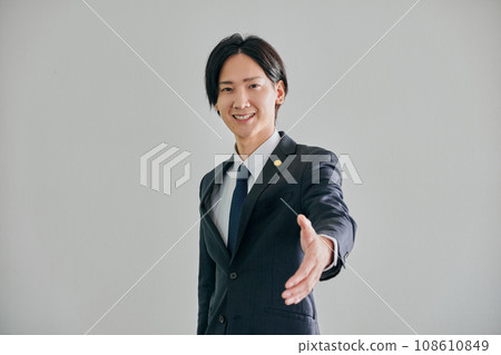 A male lawyer reaching out against a white background A male lawyer reaching out against a white background 108610849