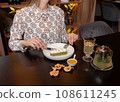 Cropped view of woman tasting vegetarian dessert 108611245