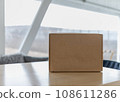 Copy-space box on table against background of cloudy autumn day 108611286
