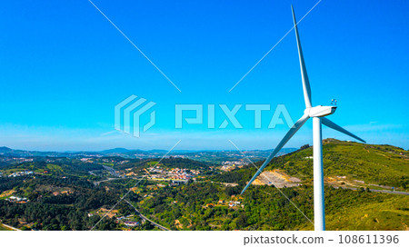 Wind turbine on the background of a small European city, a close-up view. The concept of clean Renewable energy. 108611396