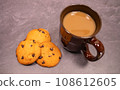 chocolate chip cookies and hot drinks 108612605