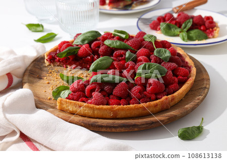 Berry pie, plates and glasses on white background, close up Berry pie, plates and glasses on white background, close up 108613138