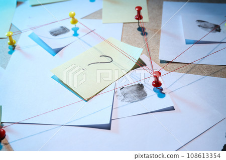 The papers are connected with threads on the board The papers are connected with threads on the board 108613354