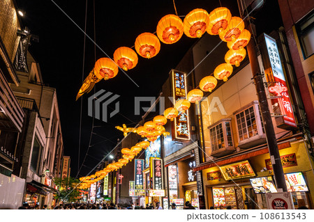 Yokohama cityscape in Japan 2024 Yokohama Chinatown with Chinese New Year lights. Dragon lanterns appear on Chinatown Boulevard = November 3rd 108613543