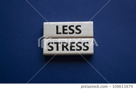 Less stress symbol. Wooden blocks with words Less stress. Beautiful deep blue background. Healthcare and Less stress concept. Copy space. 108613879