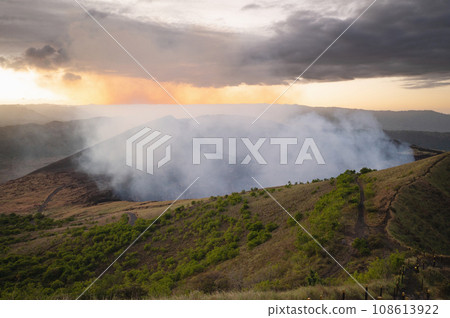 White emission gas coming from volcano ctrater 108613922