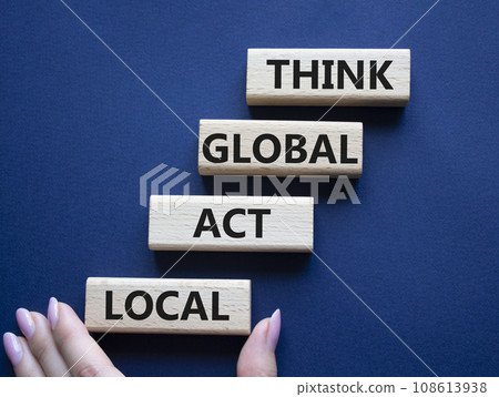 Think global act local symbol. Wooden blocks with words Think global act local . Beautiful deep blue background. Businessman hand. Business and Think global act local concept. Copy space. 108613938